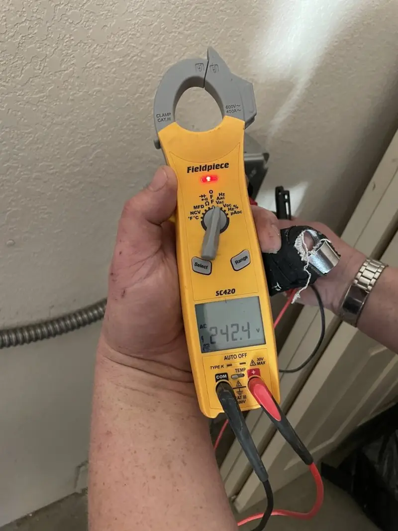 Voltage testing with clamp meter during Ceiling Fan Installation in Pequannock
